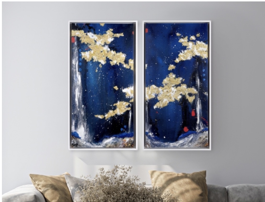 Two blue and gold artworks by Danielle O’Connor Akiyama displayed above a sofa